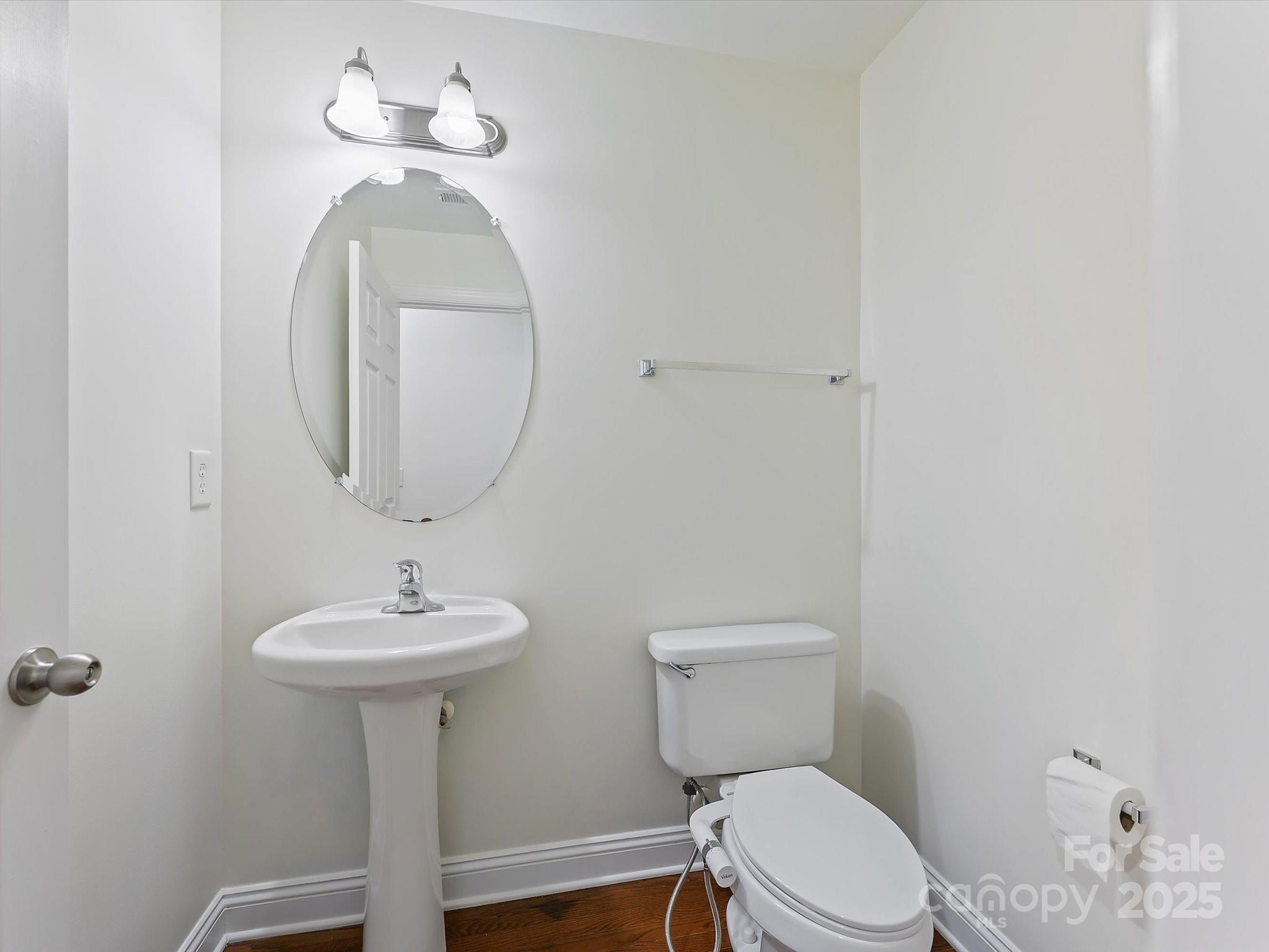 524 Becker Avenue Fort Mill, SC 29715 - Photo 24 of 39 a bathroom with a toilet sink and mirror