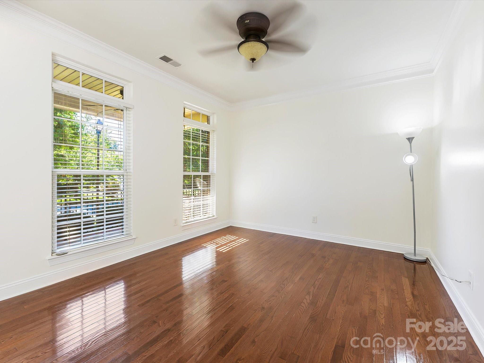 524 Becker Avenue Fort Mill, SC 29715 - Photo 6 of 39 an empty room with wooden floor and windows