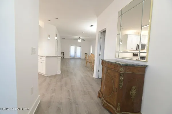 a view of a kitchen cabinets and wooden floor