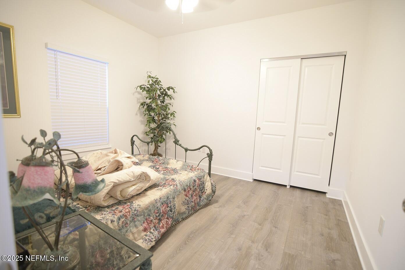 961 Calypso Way, Unit LOT 20 Jacksonville, FL 32233 - Photo 30 of 35 a bedroom with a bed and a window