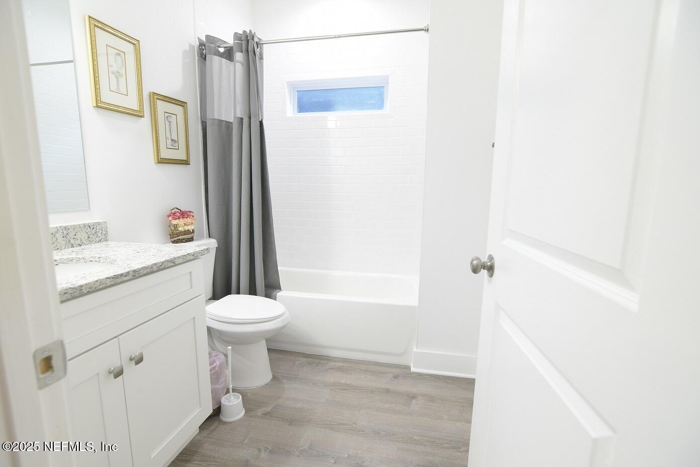 961 Calypso Way, Unit LOT 20 Jacksonville, FL 32233 - Photo 31 of 35 a bathroom with a sink toilet and shower