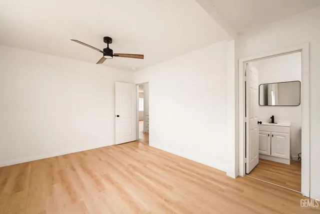 a view of a kitchen with a sink and cabinets