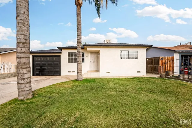 a view of a backyard of the house