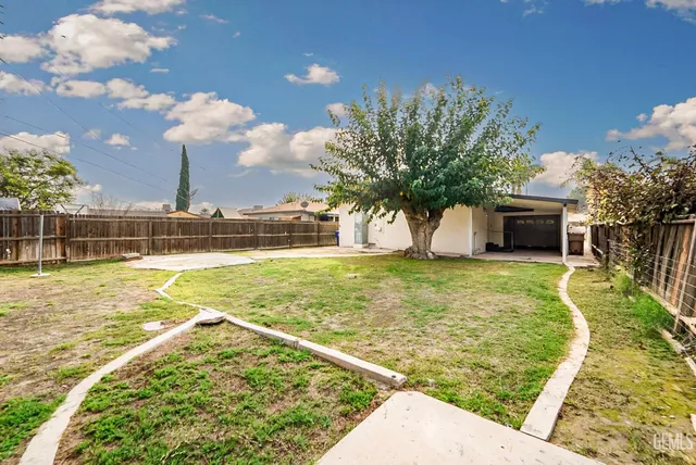 a view of swimming pool with a yard
