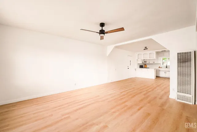 a view of a kitchen with wooden floor
