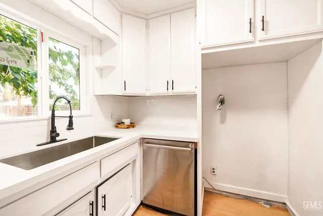 a kitchen with a sink and a window