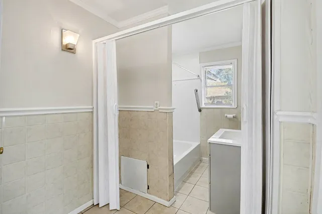 a bathroom with a bathtub and a shower