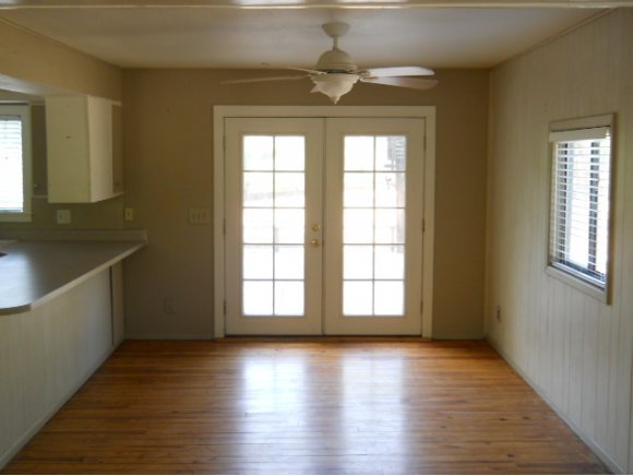 4350 East Beaver Vista Road Rimrock, AZ 86335 - Photo 5 of 8 wooden floor in an empty room with a window