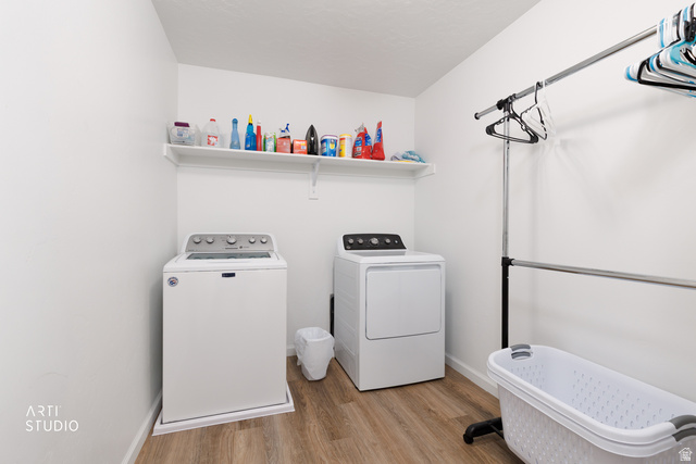 540 Lefty Lane Tooele, UT 84074 - Photo 24 of 48 Laundry area with light wood-style floors and independent washer and dryer