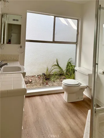 a bathroom with a glass shower door