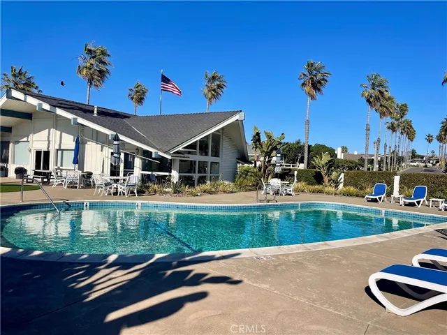 a view of a swimming pool and lounge chair
