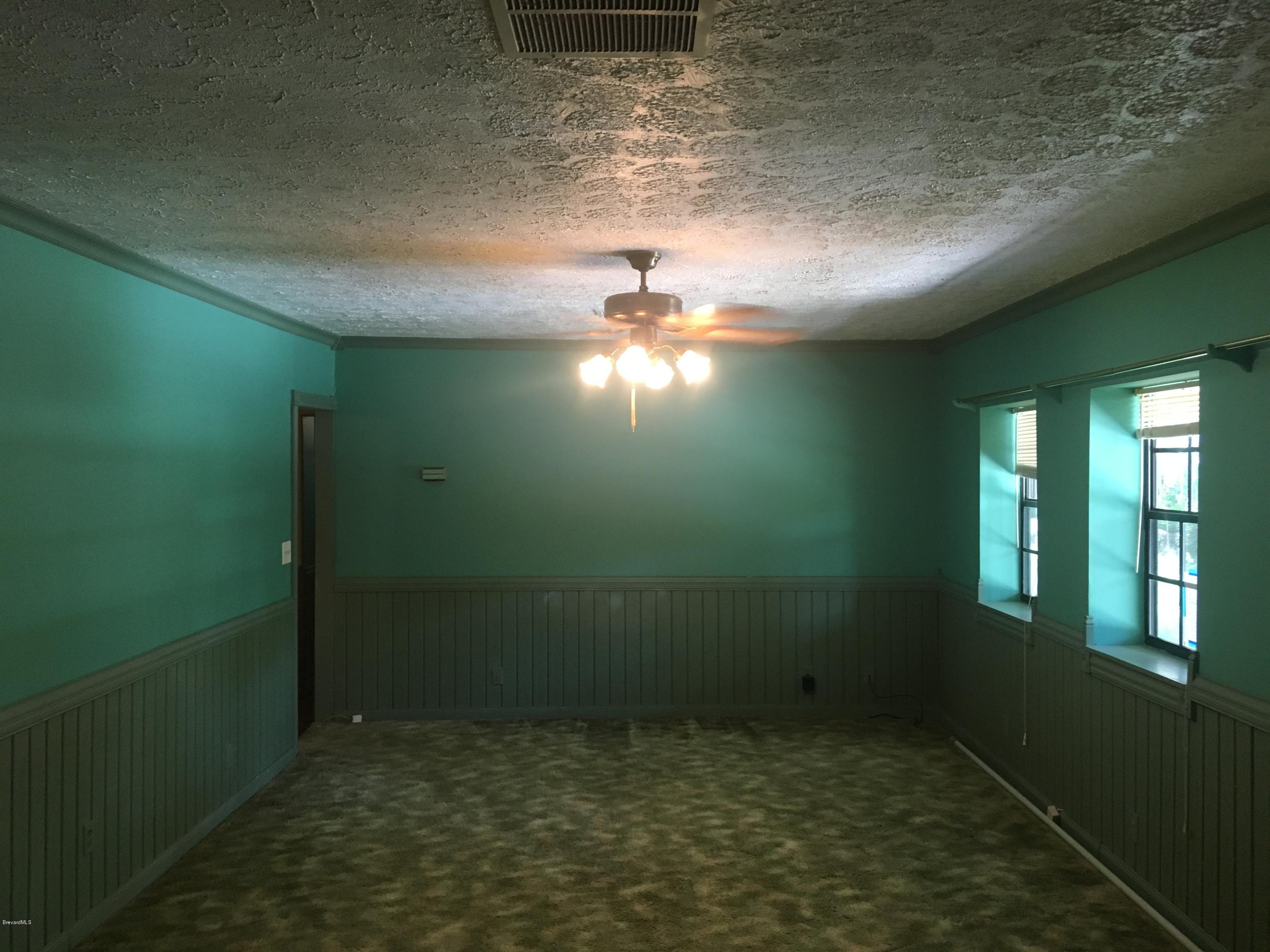 3485 Turtle Mound Road Melbourne, FL 32934 - Photo 7 of 30 Living Room/Media/Study