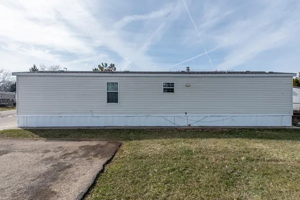a view of a backyard with hardwood