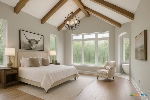 a bedroom with a bed and a large window