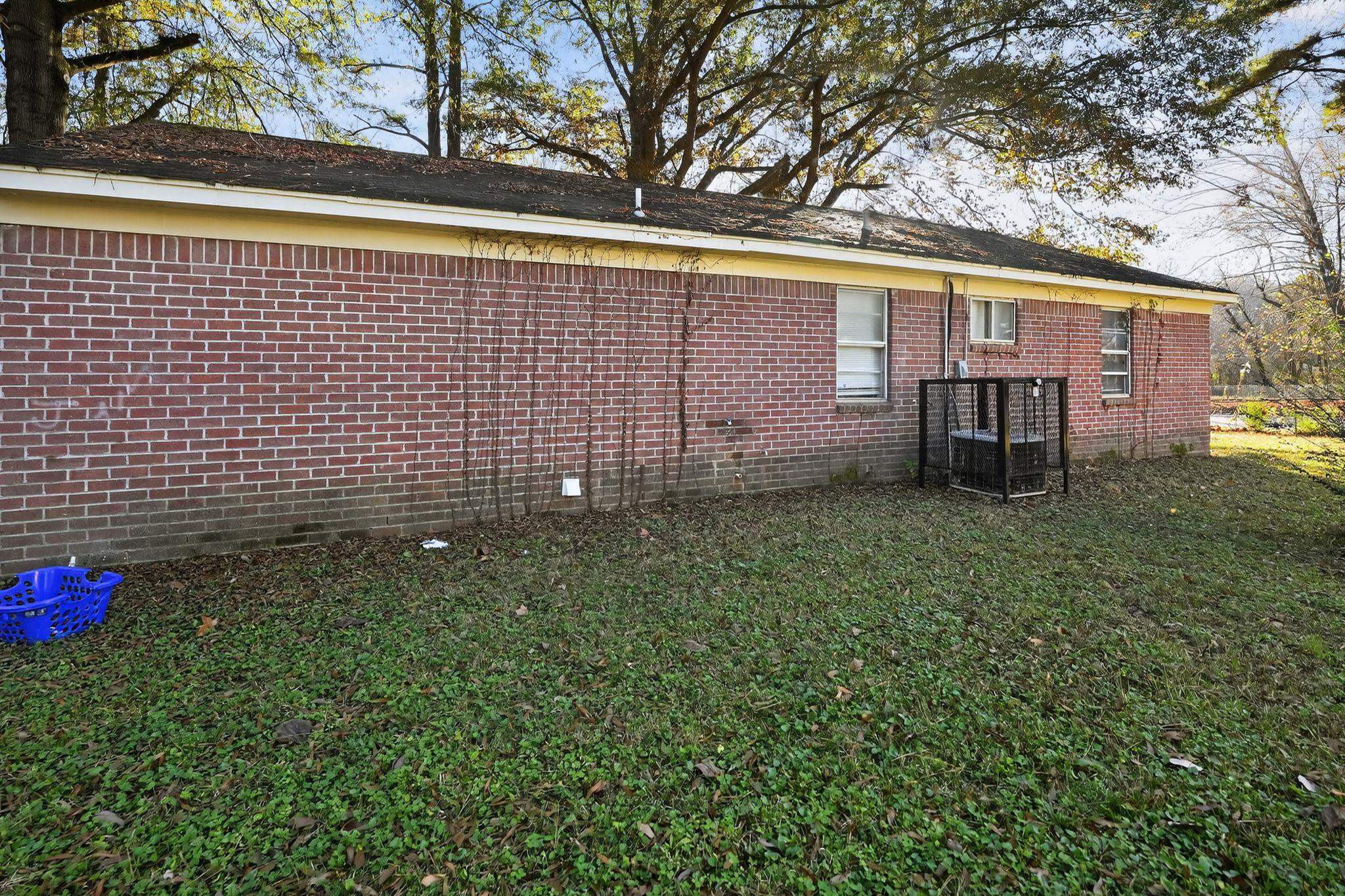 3680 Frayser-Raleigh Road Memphis, TN 38128 - Photo 28 of 40 View of side of property with brick siding and a yard