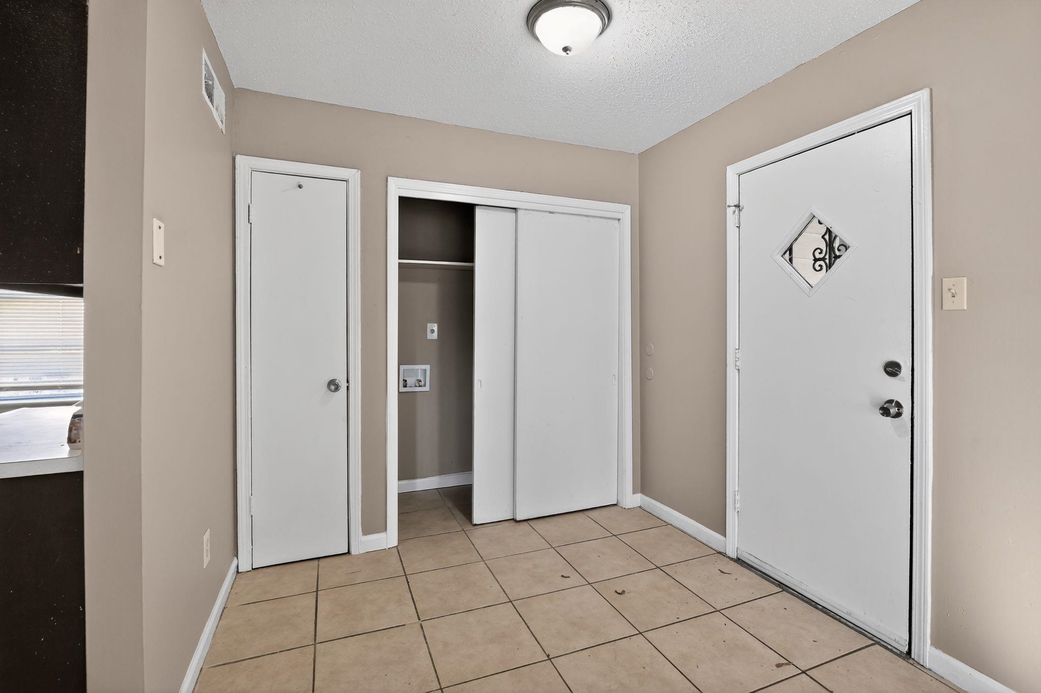 3680 Frayser-Raleigh Road Memphis, TN 38128 - Photo 8 of 40 Entryway featuring a textured ceiling and light tile patterned floors