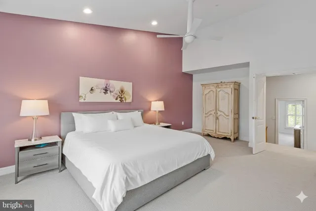 a bedroom with a bed and a lamp