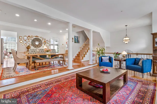 a living room with furniture and a rug