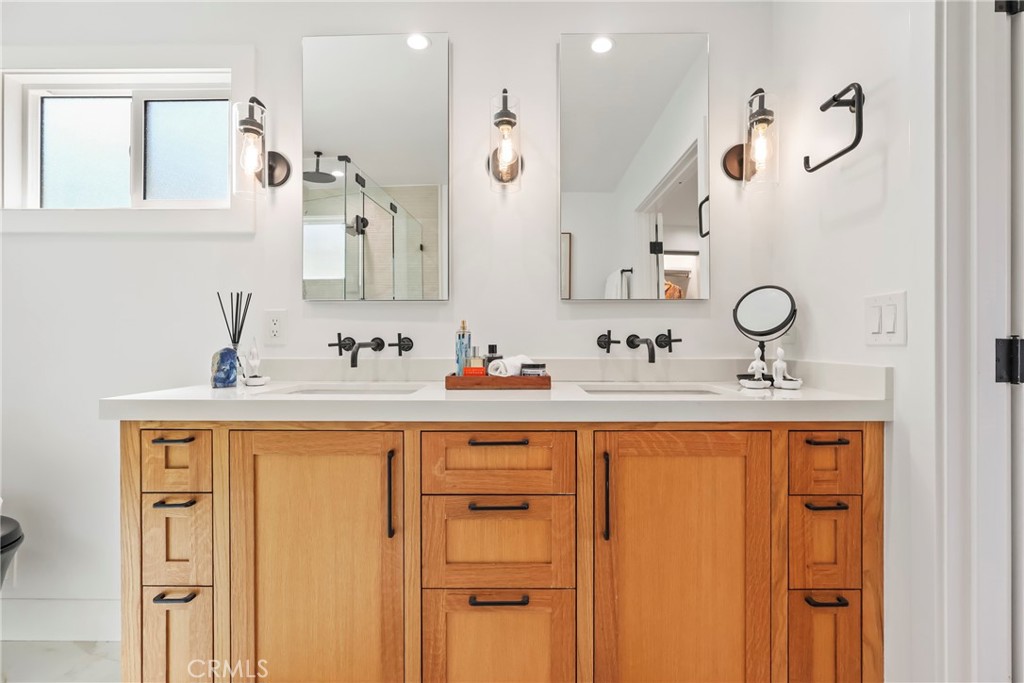 2316 La Linda Place Newport Beach, CA 92660 - Photo 11 of 31 a bathroom with a sink vanity and mirror