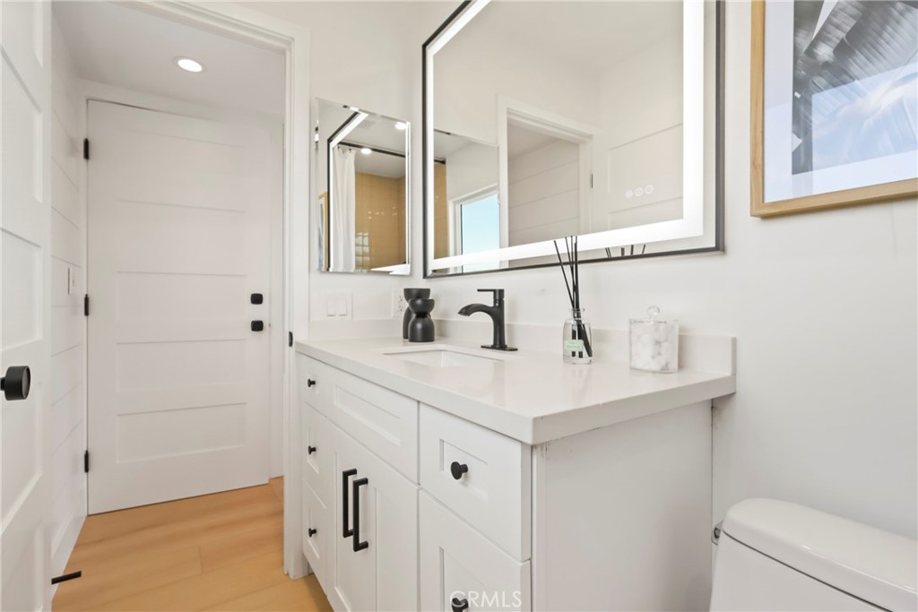 2316 La Linda Place Newport Beach, CA 92660 - Photo 21 of 31 a bathroom with a sink a toilet and shower