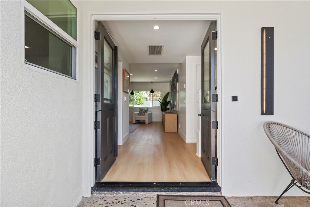 2316 La Linda Place Newport Beach, CA 92660 - Photo 23 of 31 a view of a hallway with wooden floor and a living room