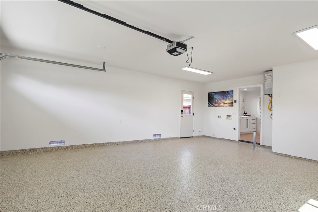 2316 La Linda Place Newport Beach, CA 92660 - Photo 31 of 31 an empty room with chandelier fan and windows