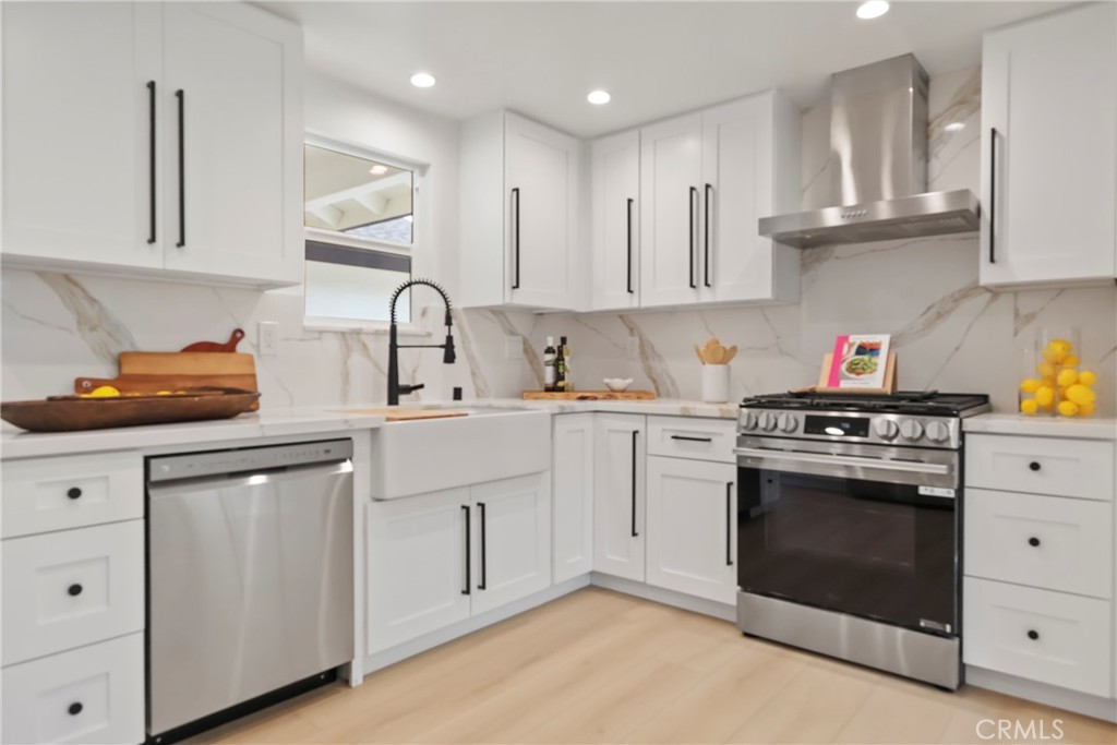 2316 La Linda Place Newport Beach, CA 92660 - Photo 4 of 31 a kitchen with cabinets appliances and a sink