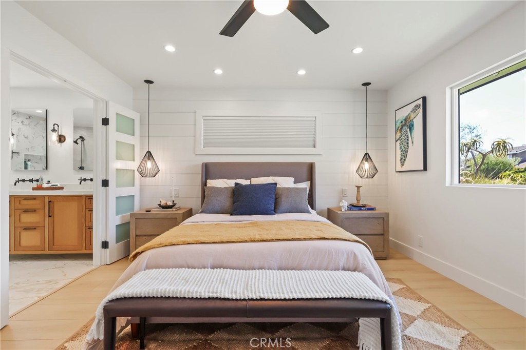 2316 La Linda Place Newport Beach, CA 92660 - Photo 8 of 31 a bedroom with a bed and a chandelier