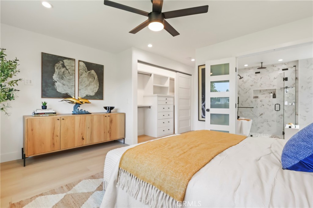 2316 La Linda Place Newport Beach, CA 92660 - Photo 9 of 31 a bedroom with a large bed and a chandelier