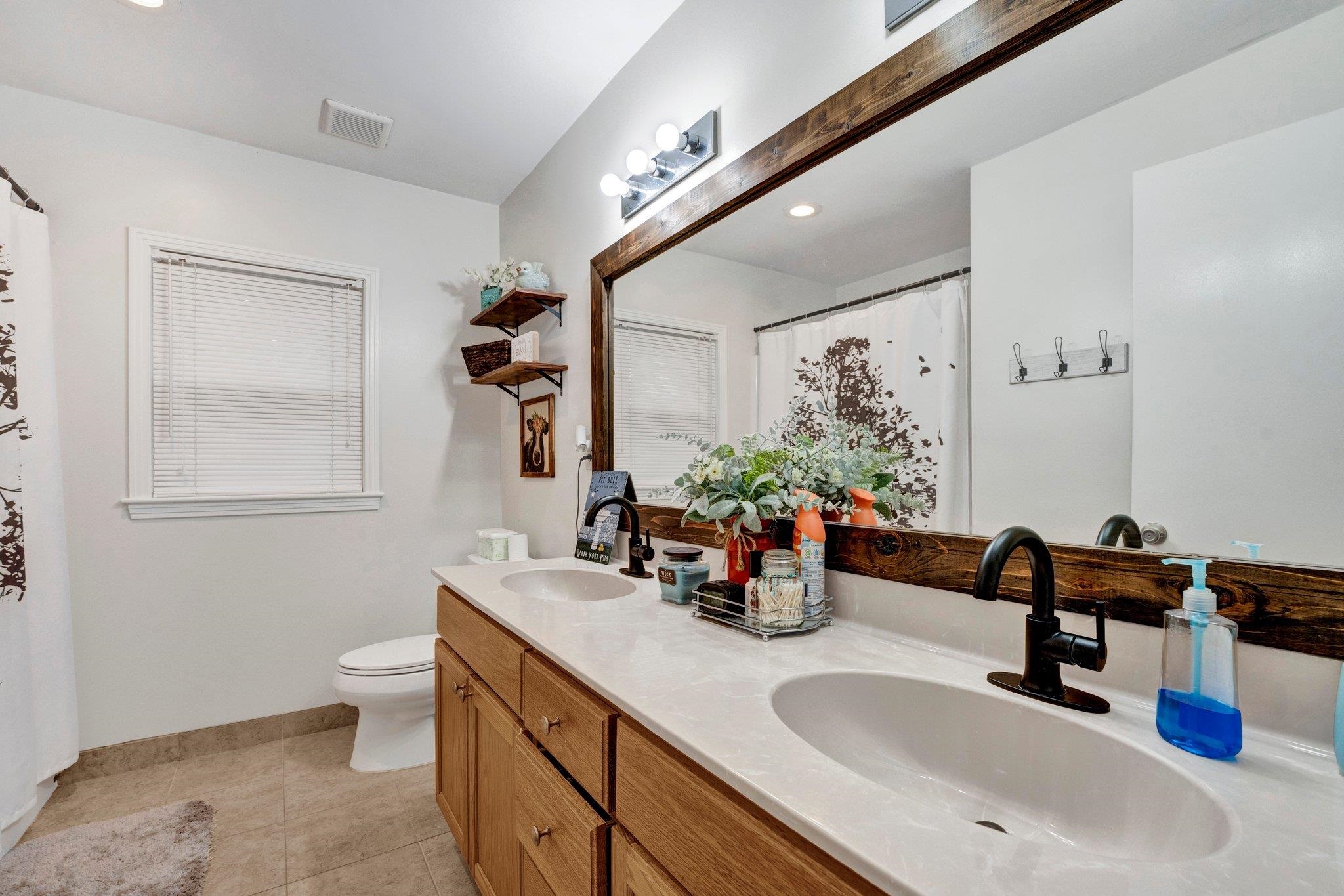 5050 Brunswick Road Bartlett, TN 38002 - Photo 12 of 35 a bathroom with a sink and a mirror