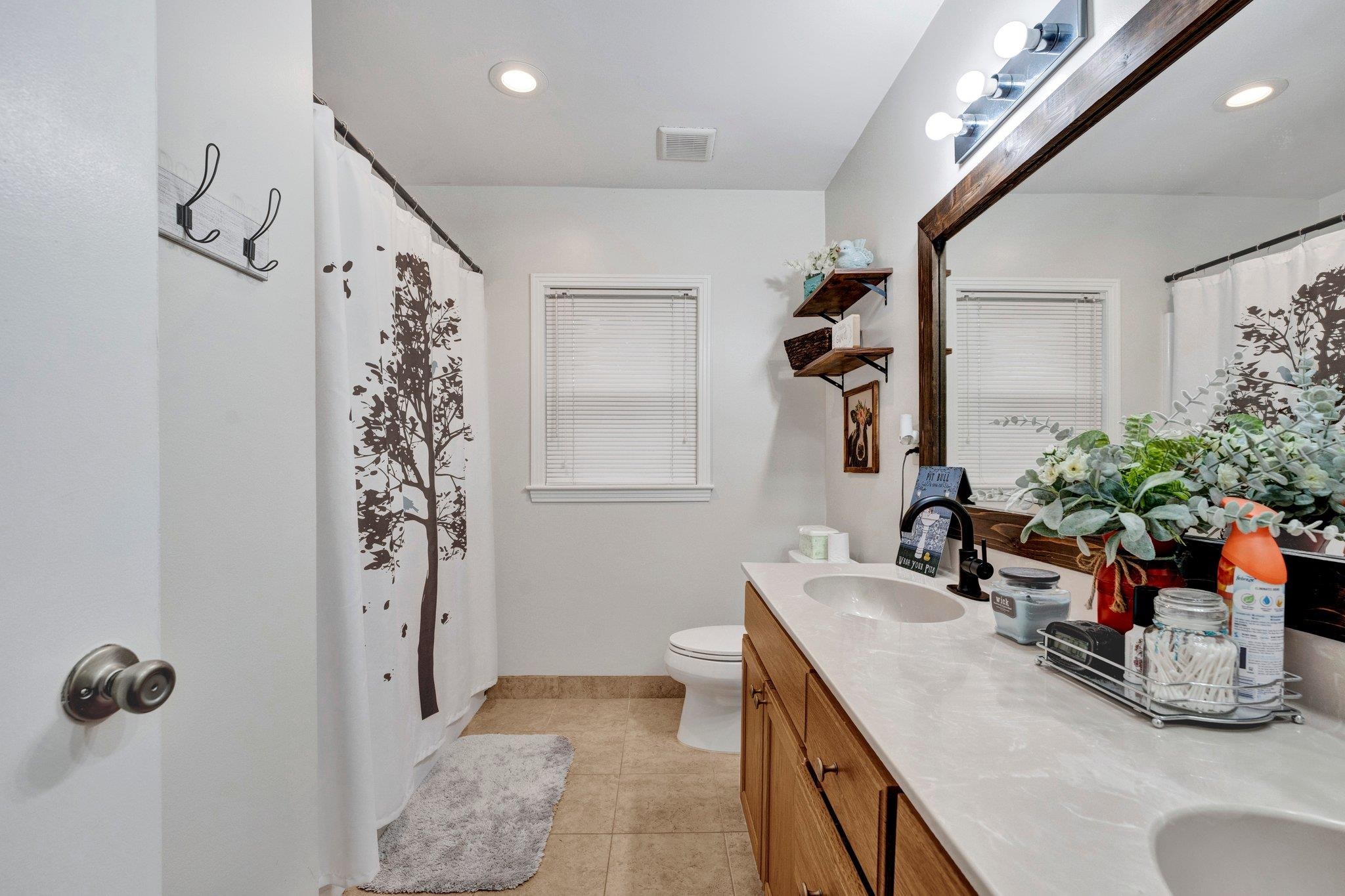 5050 Brunswick Road Bartlett, TN 38002 - Photo 13 of 35 a bathroom with a granite countertop sink a mirror a vanity and shower