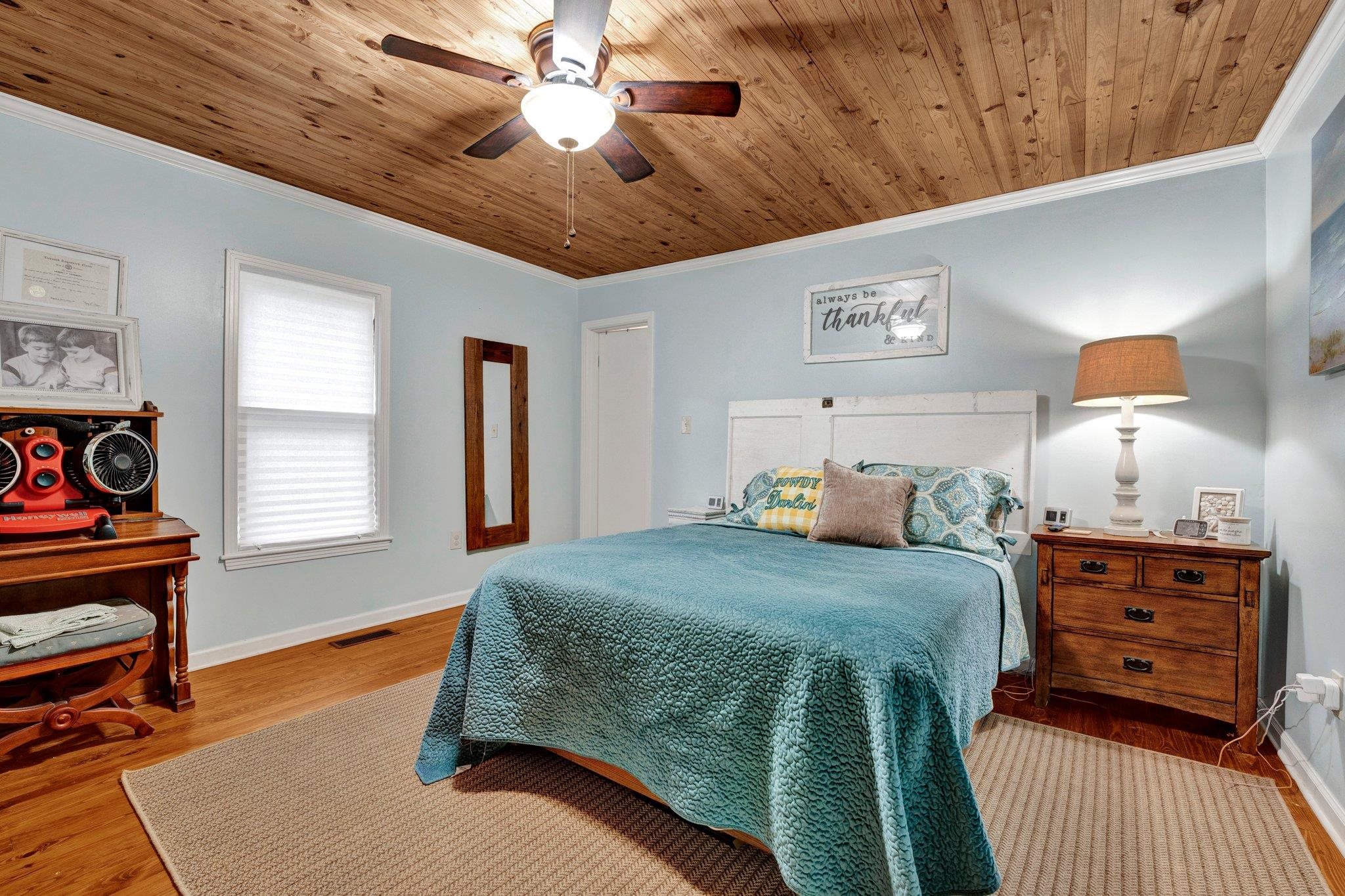 5050 Brunswick Road Bartlett, TN 38002 - Photo 15 of 35 a bedroom with a bed and a chandelier