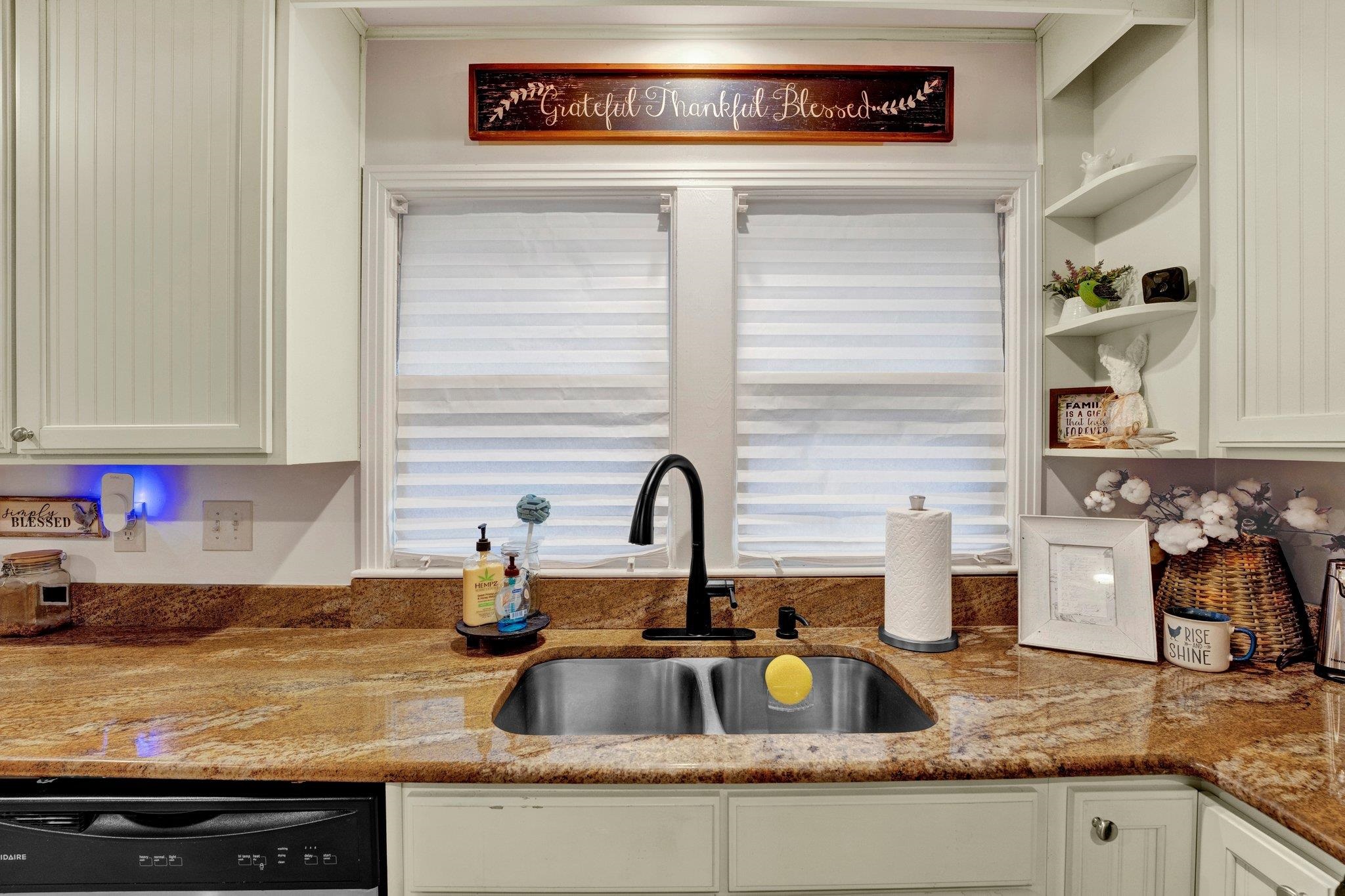 5050 Brunswick Road Bartlett, TN 38002 - Photo 22 of 35 a kitchen with sink a stove and cabinets