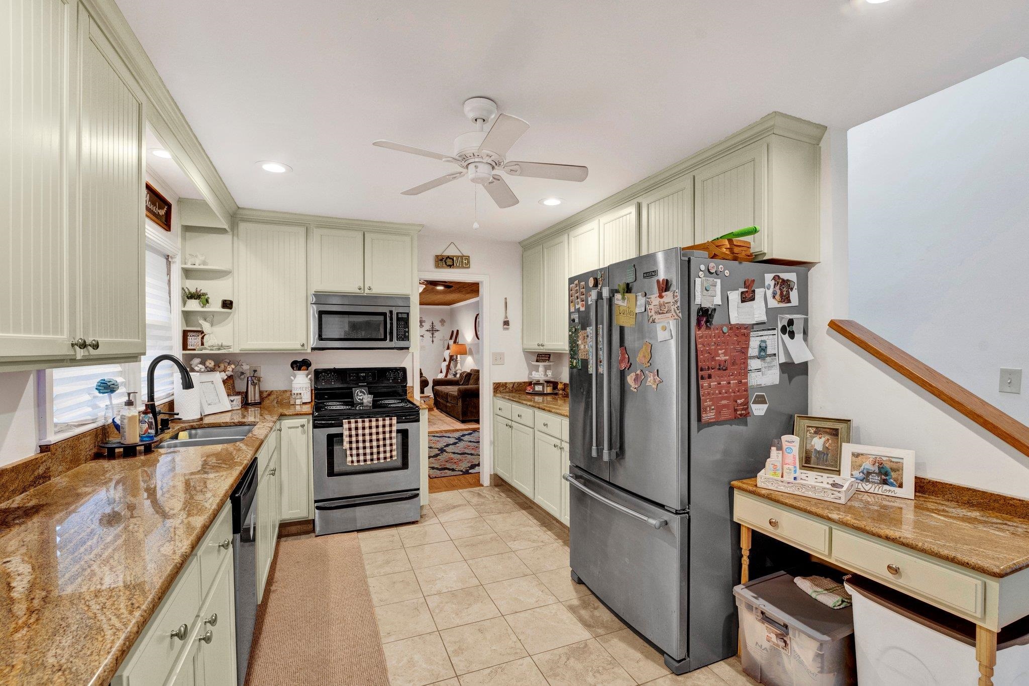 5050 Brunswick Road Bartlett, TN 38002 - Photo 24 of 35 a kitchen with stainless steel appliances granite countertop a refrigerator stove and sink