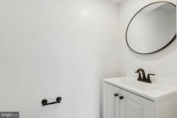 a bathroom with a sink and mirror