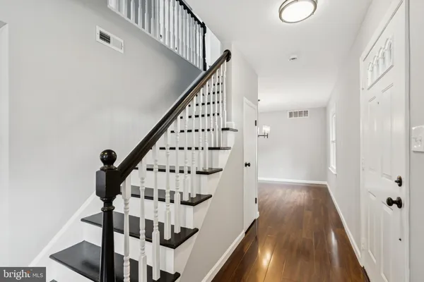 a view of entryway with wooden floor