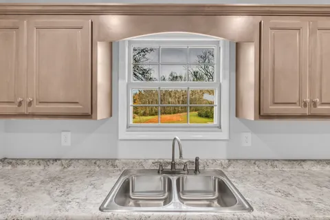 a kitchen with a sink and cabinets