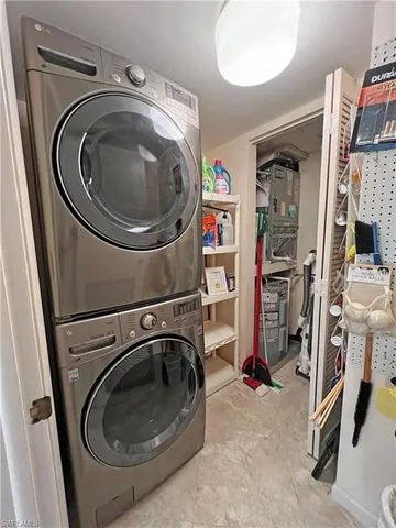 a view of a balcony with wooden floor and fence