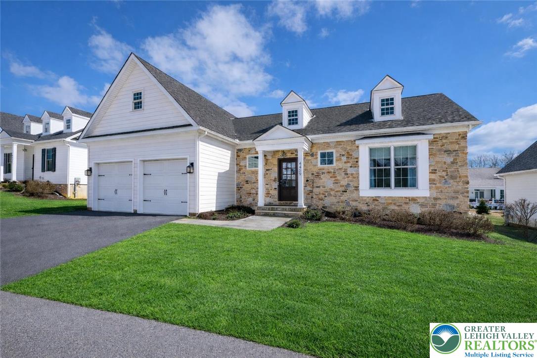 a front view of a house with a yard