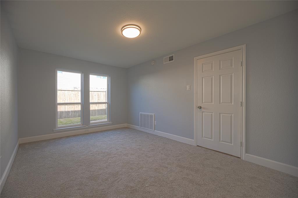 733 Intrepid Drive Garland, TX 75043 - Photo 12 of 25 Carpeted down stairs bedroom