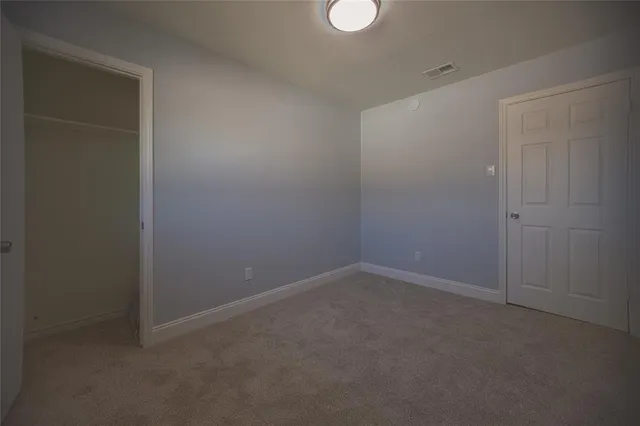 a bathroom with a toilet and sink