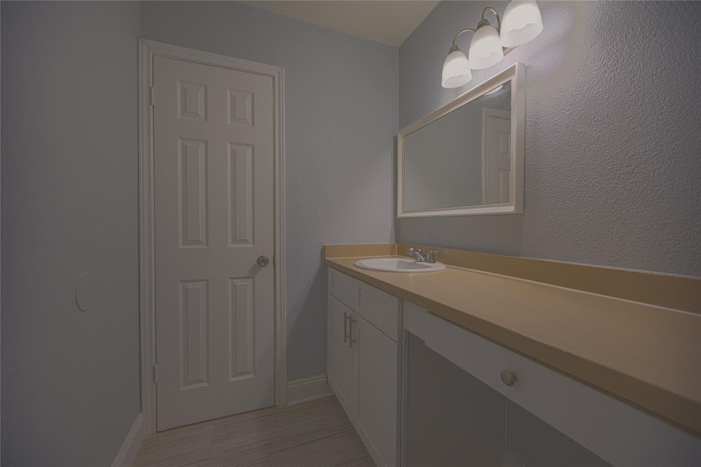 733 Intrepid Drive Garland, TX 75043 - Photo 17 of 25 Upstairs bathroom with vanity