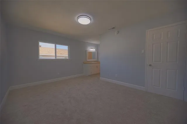 a view of a hallway with a window