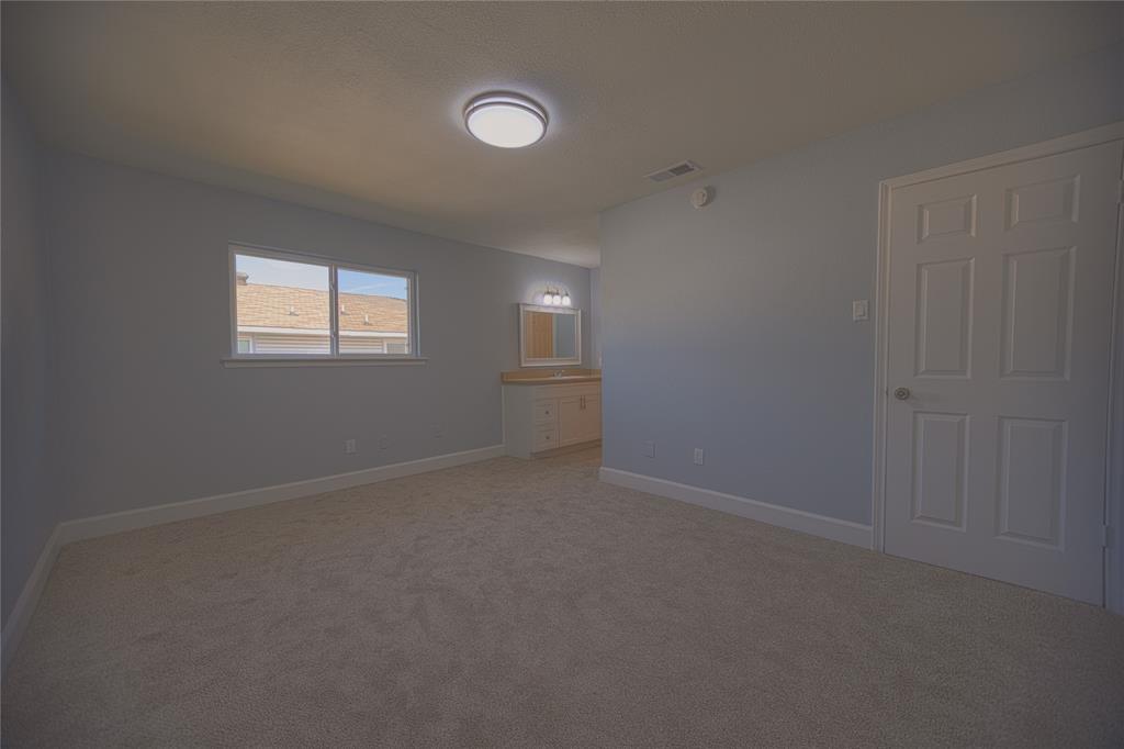 733 Intrepid Drive Garland, TX 75043 - Photo 20 of 25 Upstairs 4th bedroom with light carpet and connected bathroom