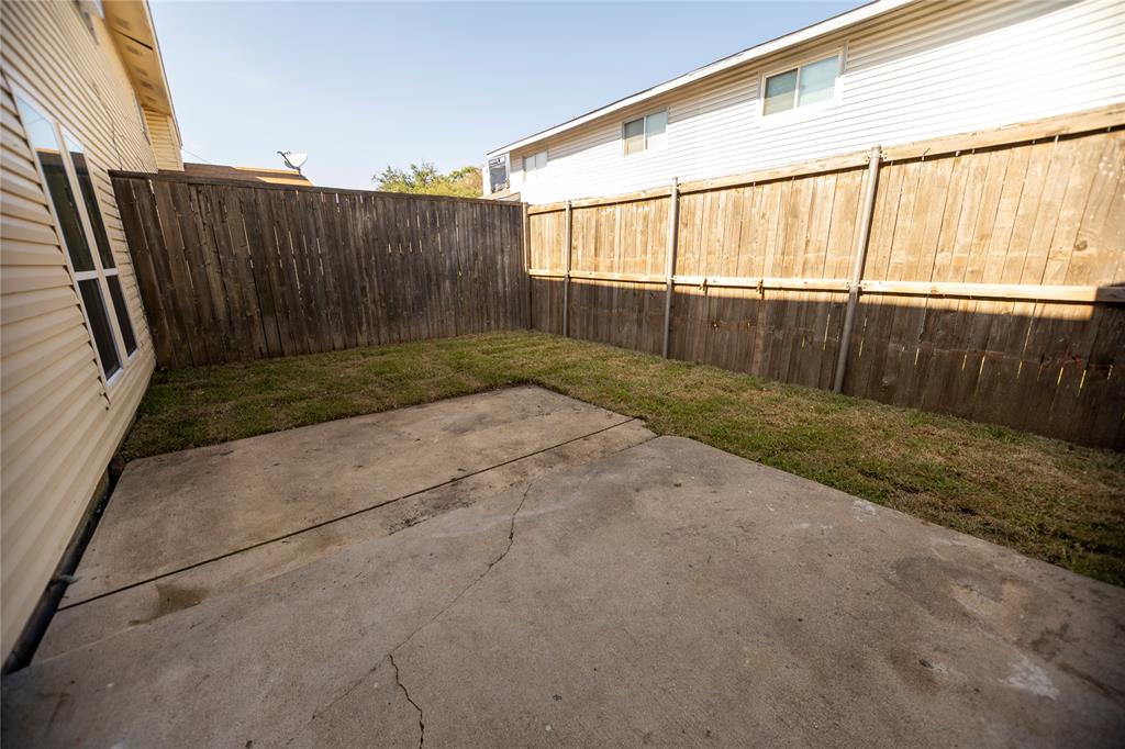 733 Intrepid Drive Garland, TX 75043 - Photo 25 of 25 Fenced backyard with a patio area