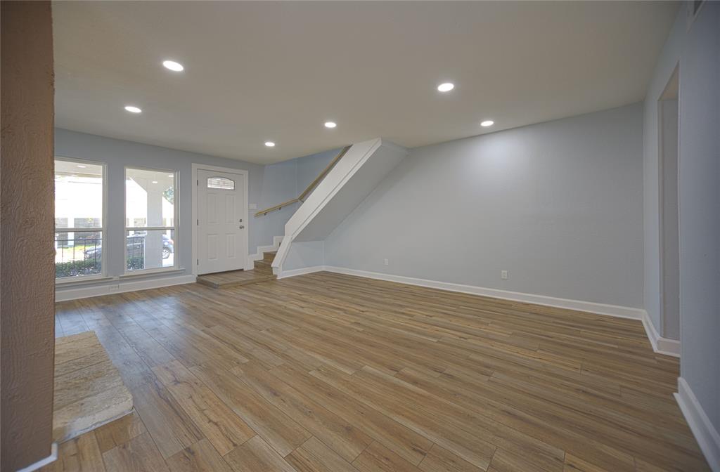 733 Intrepid Drive Garland, TX 75043 - Photo 4 of 25 living room with light wood-type flooring, recessed lighting, and stairs
