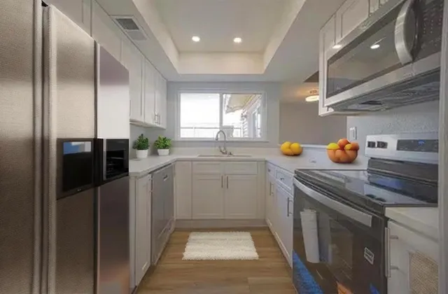 a kitchen that has a sink and a stove in it