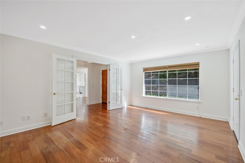 5974 Ruthwood Drive Calabasas, CA 91302 - Photo 12 of 30 a view of empty room with wooden floor and windows