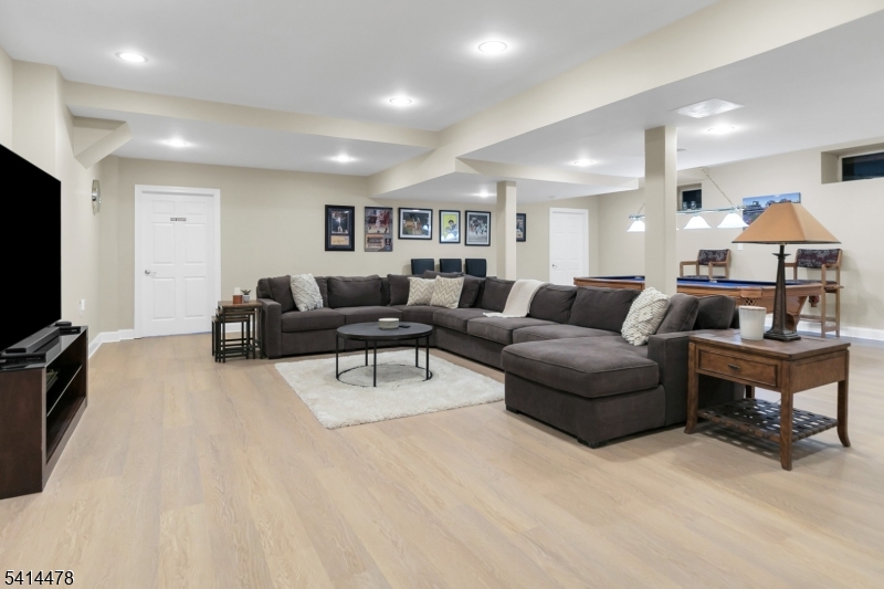 33 St Nickolas Way Bernards, NJ 07920 - Photo 32 of 50 a living room with furniture and a flat screen tv