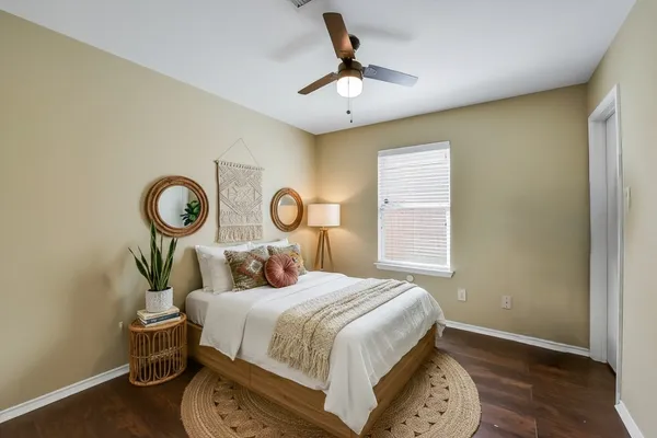 an empty room with windows and entrance